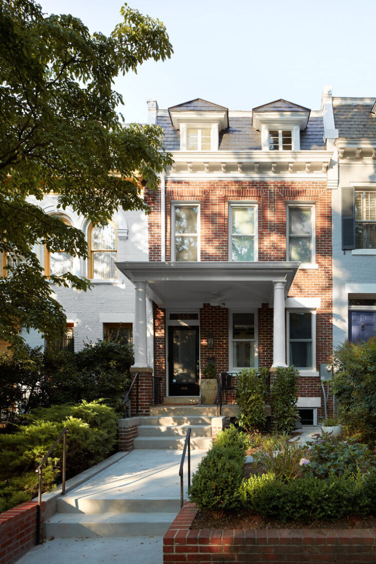 the row house sits on a street of similarly charming, traditional homes in d.c. 9