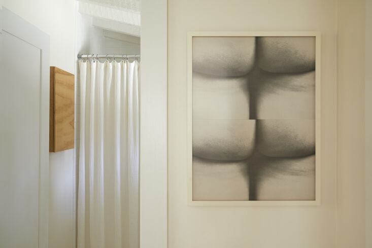 a print of yoko ono and george maciuna&#8\2\17;s fluxus wallpaper hangs in 14