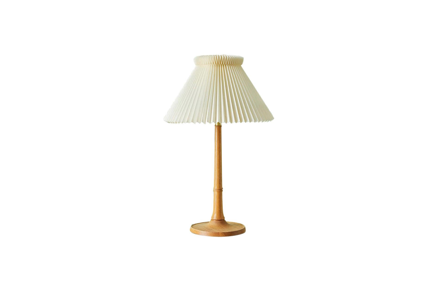 on the table is the vintage le klint oak table lamp, available for \$\1,995.\15 19