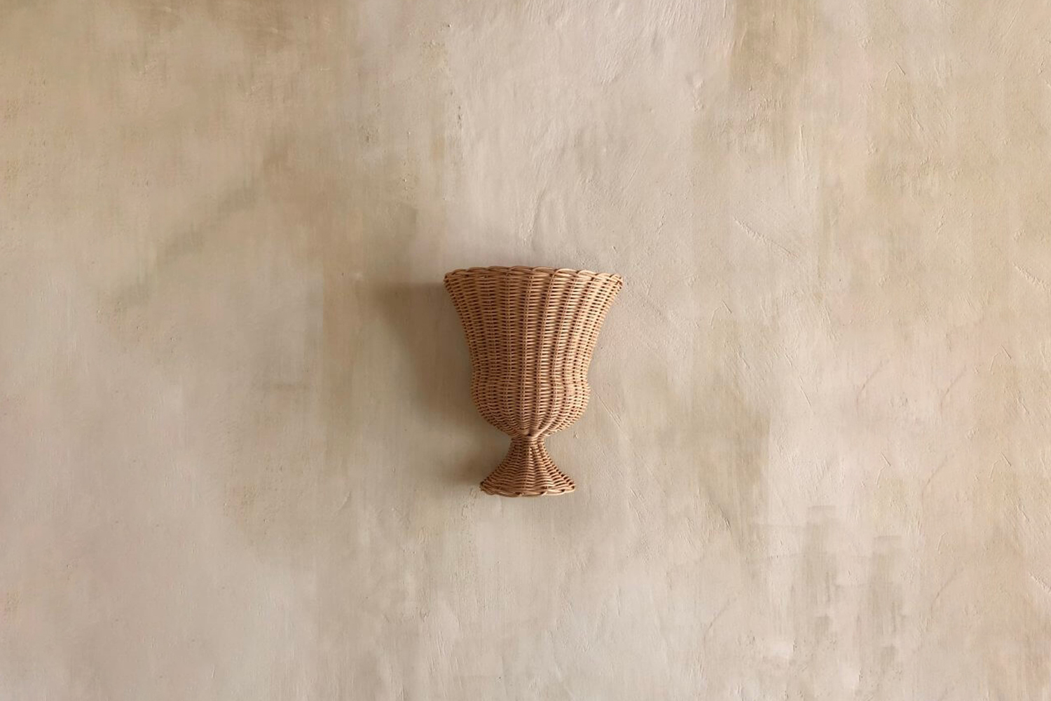 the atelier vime medici sconce is handmade of rattan in france; €880 at ateli 20