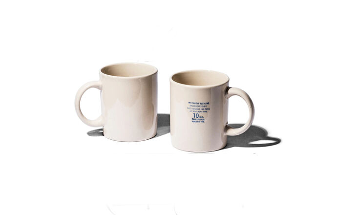 the standard \10 ounce mugs have stamped on care instructions in lieu of design 10